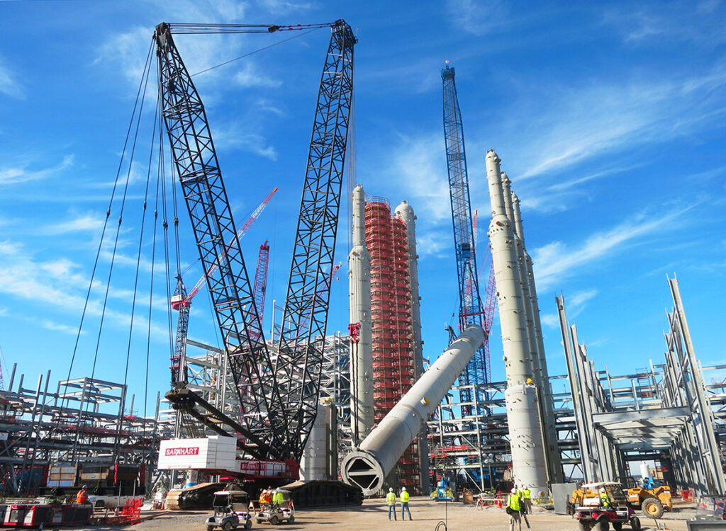 Barnhart's crane upends a vessel at an industrial site.