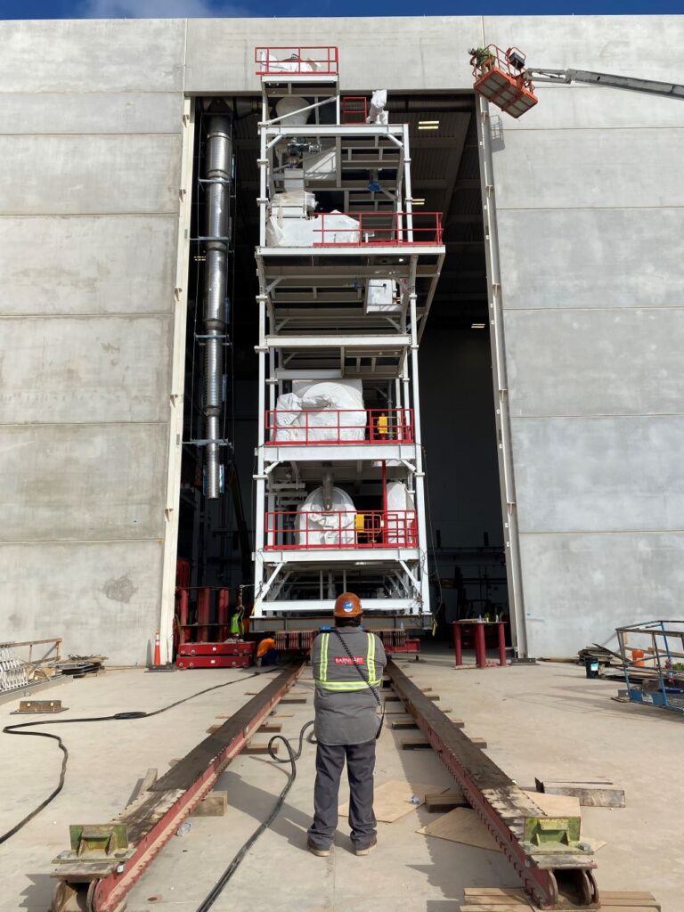 Barnhart’s custom-designed system to lift, stack, and relocate 10 prefabricated modules.